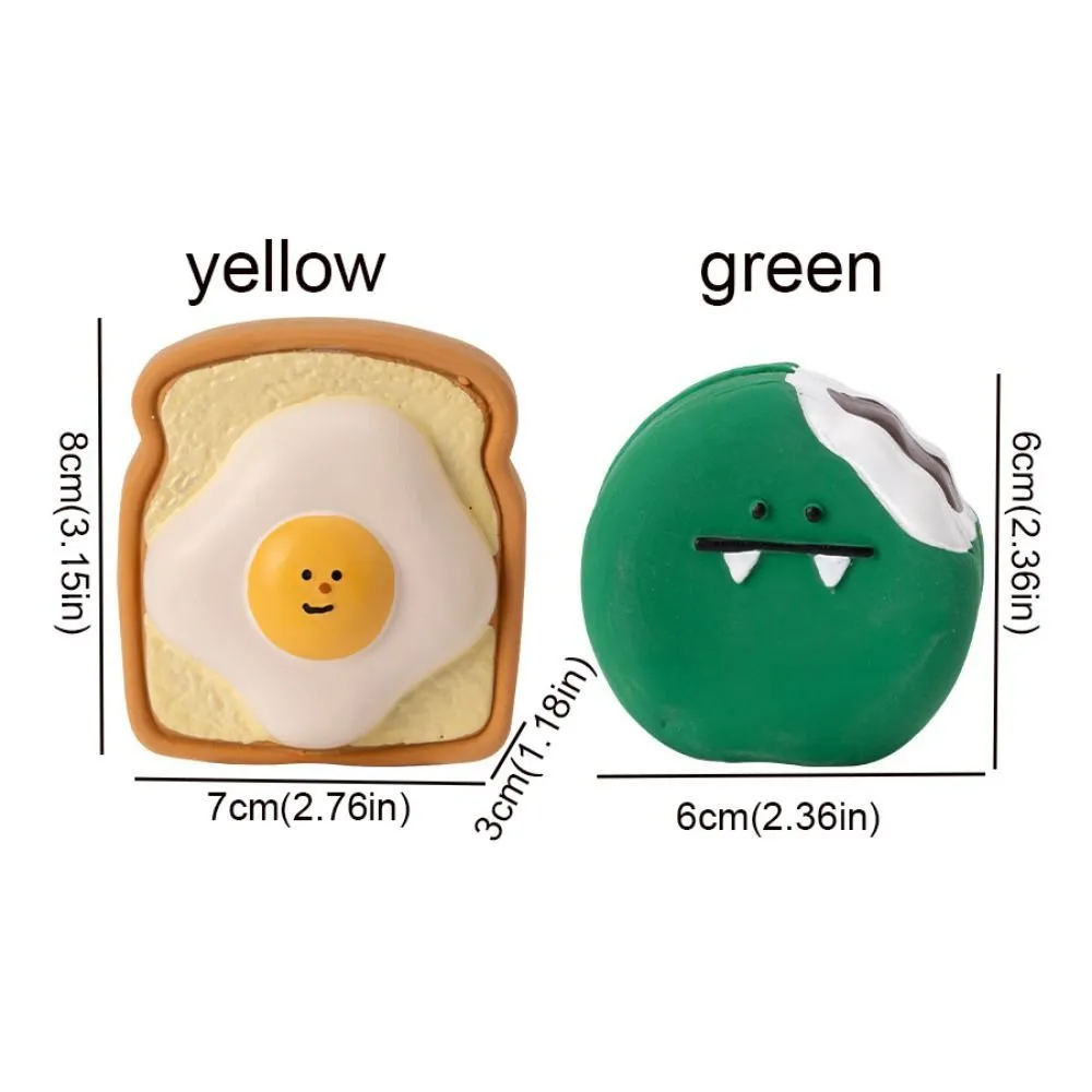 Yellow and green latex dog chew toy shaped like an egg bread with a cartoon puppy pattern.