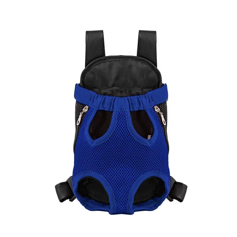 A small dog sitting in a breathable mesh carrier backpack worn on a person's front.