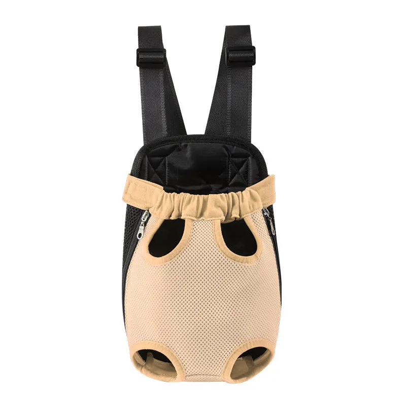 A small dog sitting in a breathable mesh carrier backpack worn on a person's front.