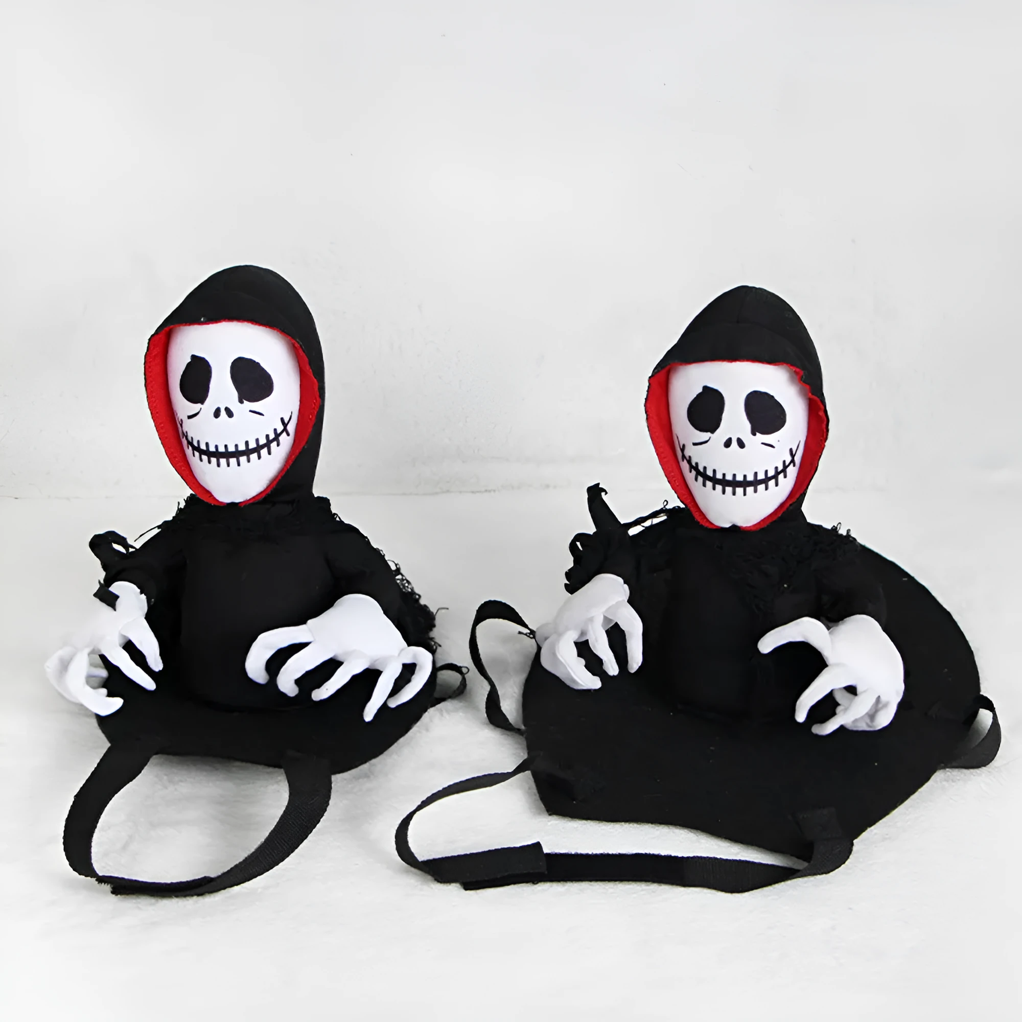 Black polyester Halloween teddy cape for cats and small dogs, shown flat on a surface