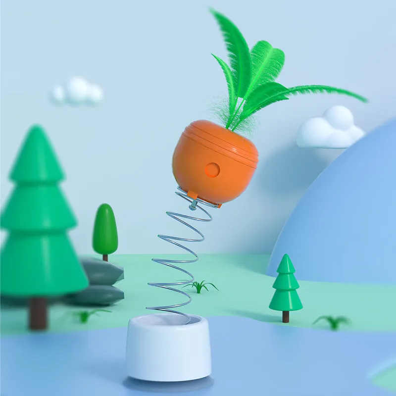 Carrot-shaped self-playing food-leaking tumbler cat toy on a light floor