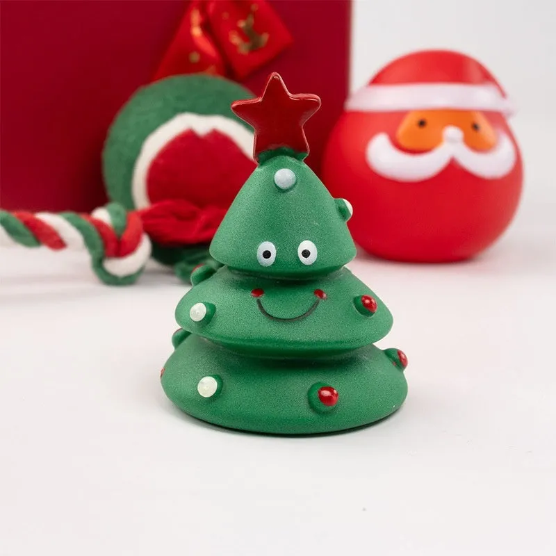 Seven sets of Christmas-themed vinyl dog toys including barbells, balls, ropes, and Santa figures.
