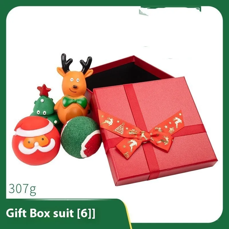 Seven sets of Christmas-themed vinyl dog toys including barbells, balls, ropes, and Santa figures.