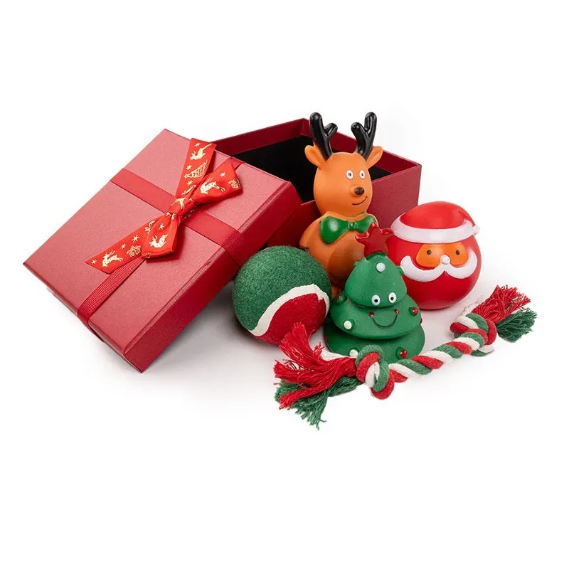 Seven sets of Christmas-themed vinyl dog toys including barbells, balls, ropes, and Santa figures.