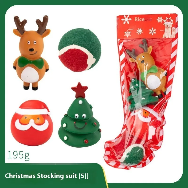 Seven sets of Christmas-themed vinyl dog toys including barbells, balls, ropes, and Santa figures.