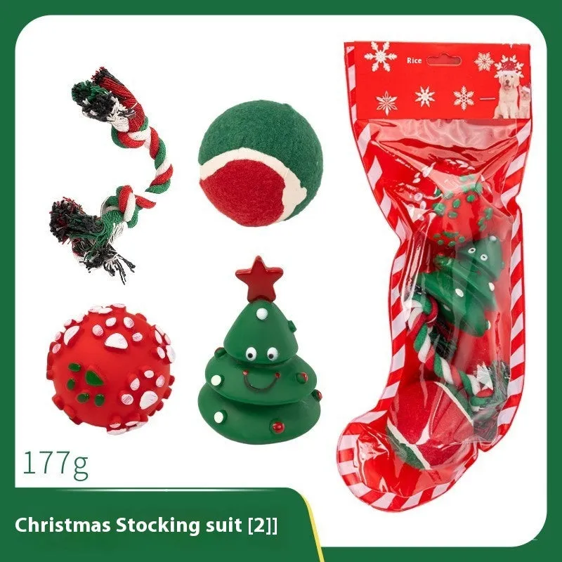 Seven sets of Christmas-themed vinyl dog toys including barbells, balls, ropes, and Santa figures.