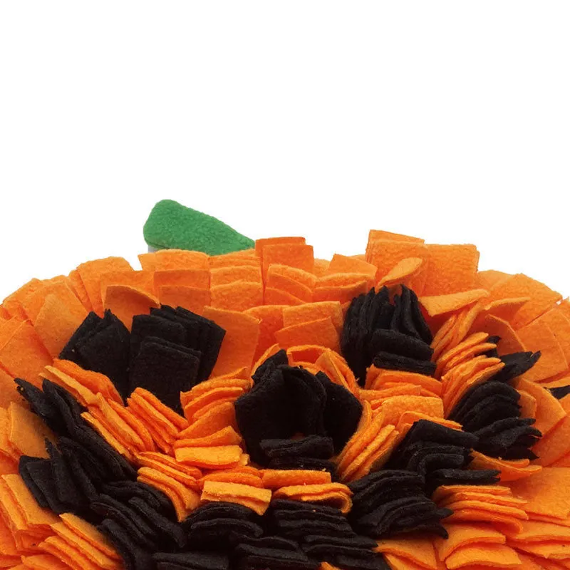 Orange pumpkin-shaped dog sniffing mat with raised fur textures for slow feeding and treat hiding.