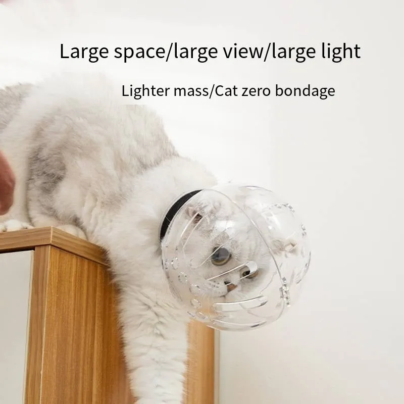 Transparent plastic cat muzzle hood with adjustable Velcro strap shown in three sizes.
