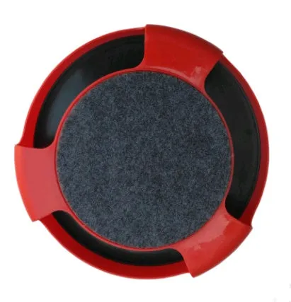 Blue rotating plastic cat toy with felt scratchpad on top standing on a floor