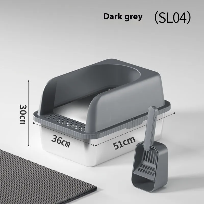 Dark gray stainless steel double-layer cat litter box with sand pad and scoop on a mat – medium size