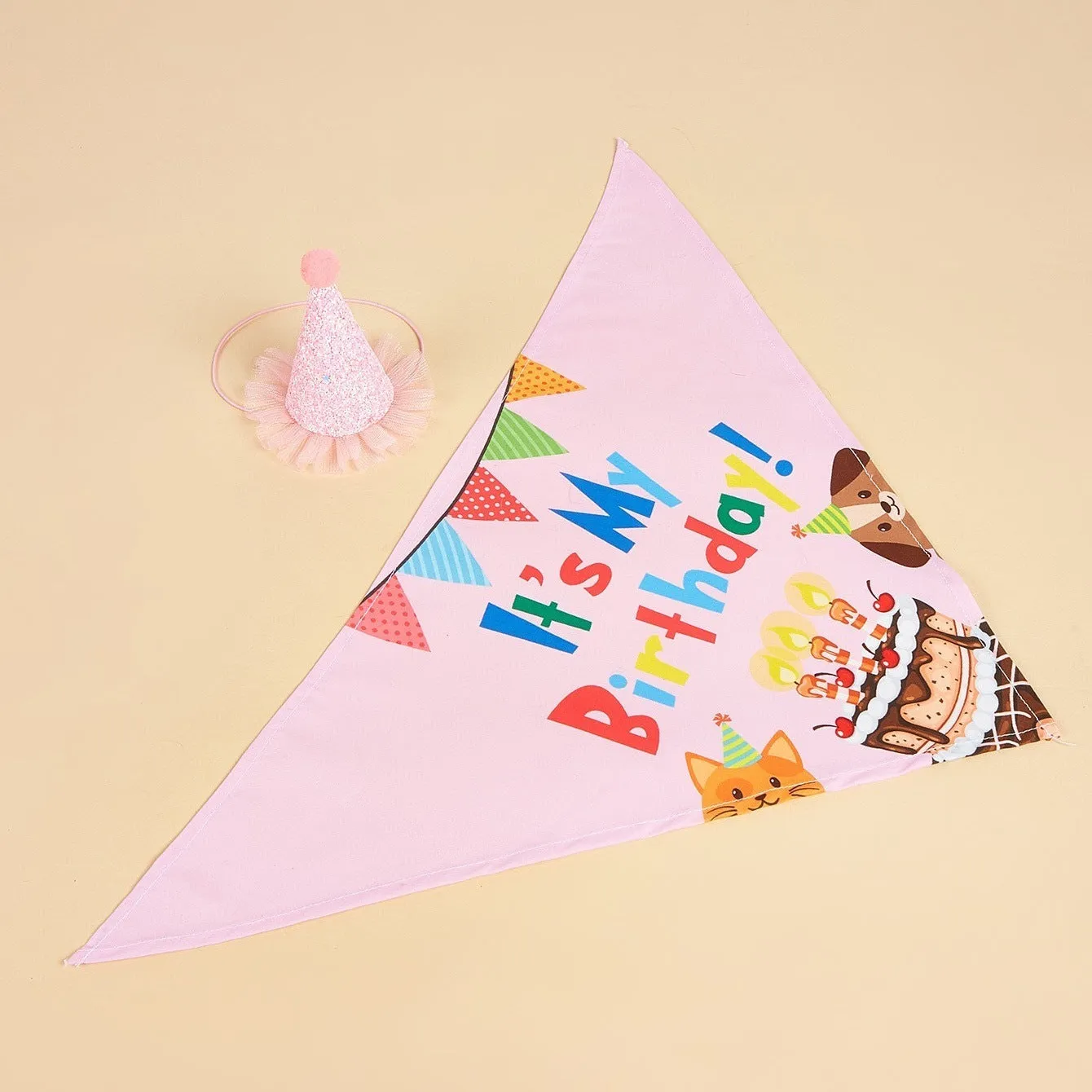 Printed polyester dog birthday hat and drool towel set in blue with creative triangular binder design