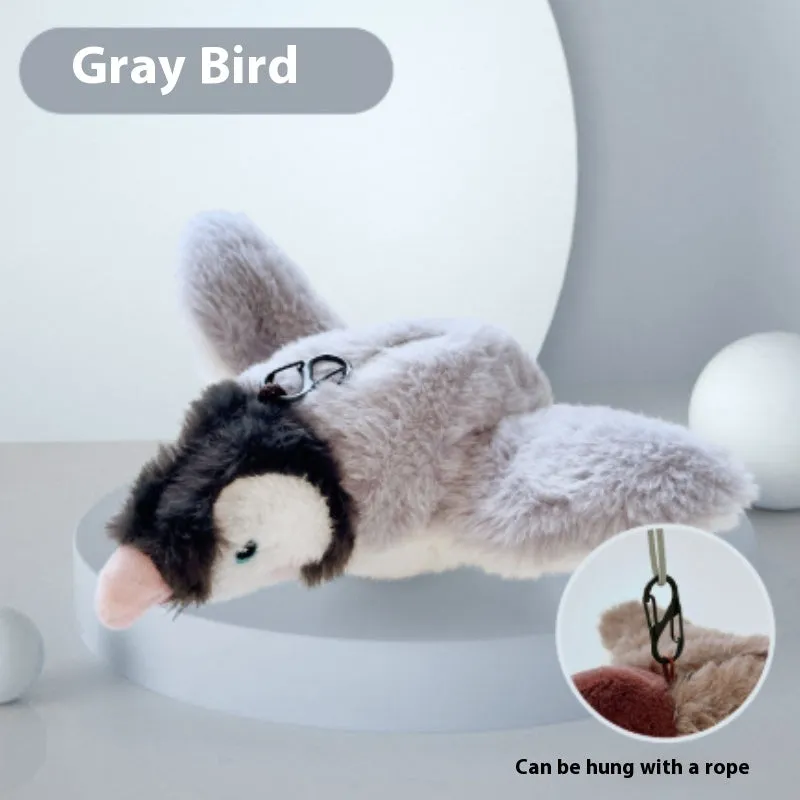 Pet plush bite resistant toy with electric shaking in light gray on a floor