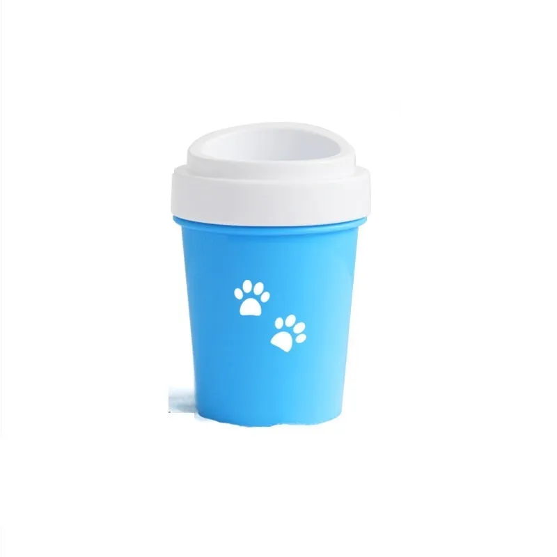 Blue silicone dog paw cleaner cup with soft bristles and easy-grip design on a white surface