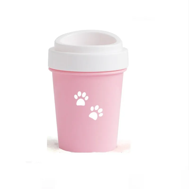 Blue silicone dog paw cleaner cup with soft bristles and easy-grip design on a white surface
