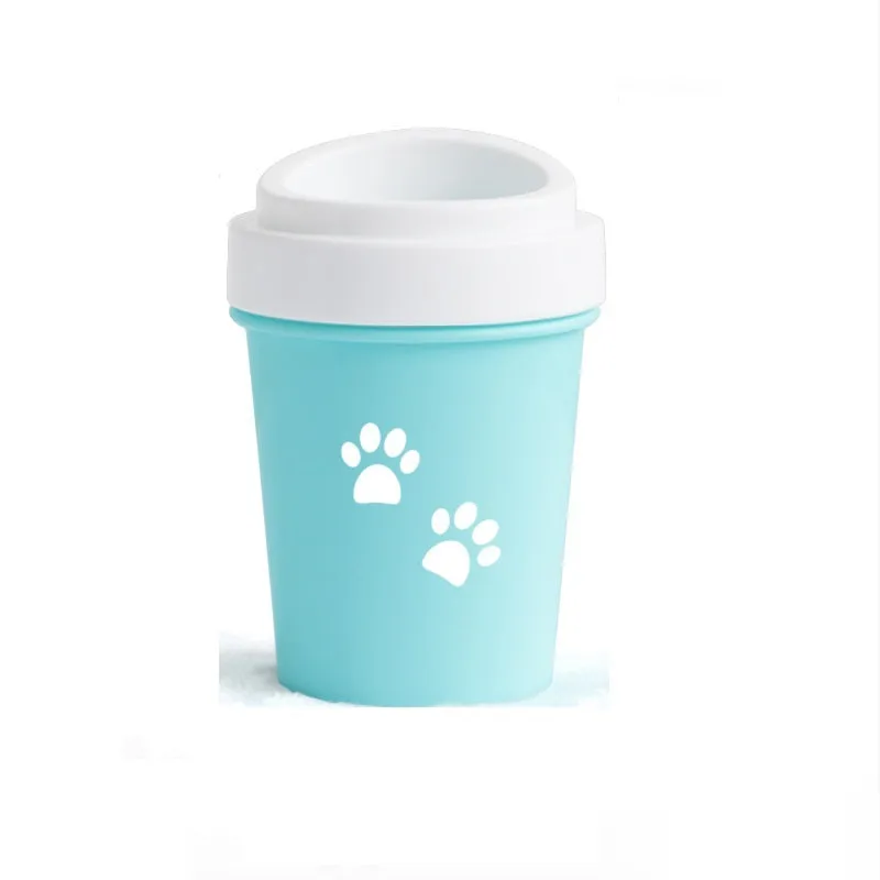 Blue silicone dog paw cleaner cup with soft bristles and easy-grip design on a white surface