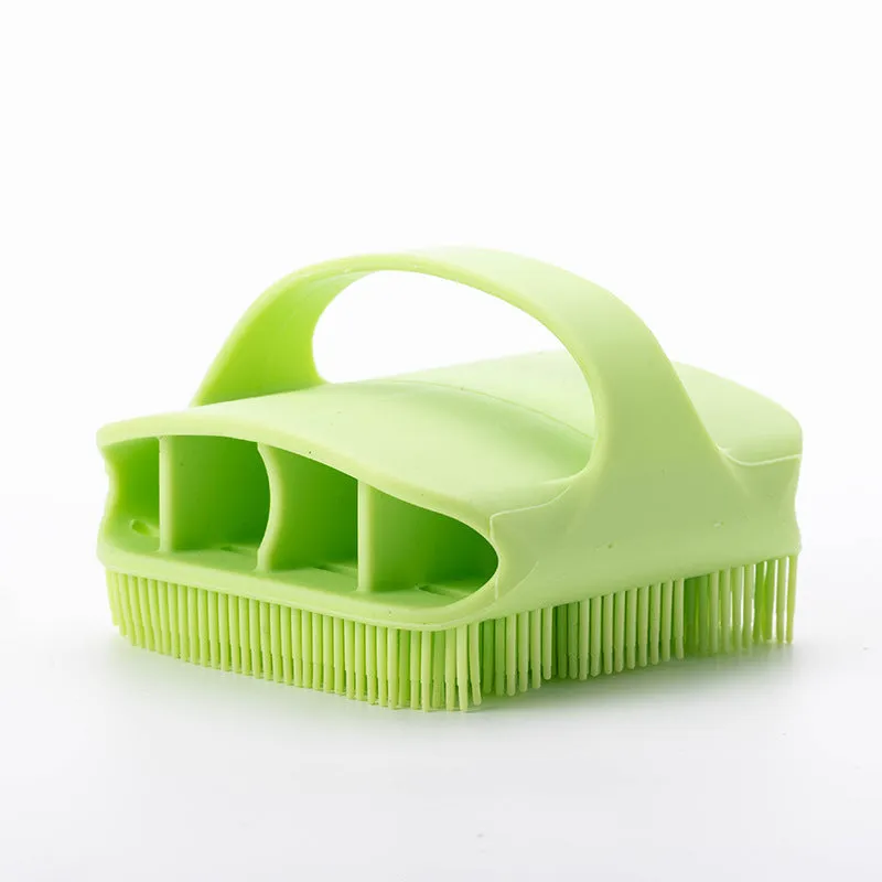 Blue silicone scalp massager brush with long bristles and a hand-through ergonomic handle.