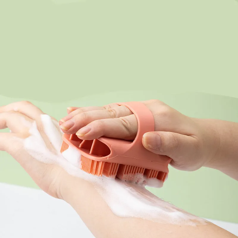 Blue silicone scalp massager brush with long bristles and a hand-through ergonomic handle.