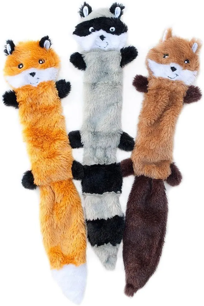 Set of three Peltz unstuffed squeaky dog toys - fox, raccoon, and squirrel - 18 inches long on white background