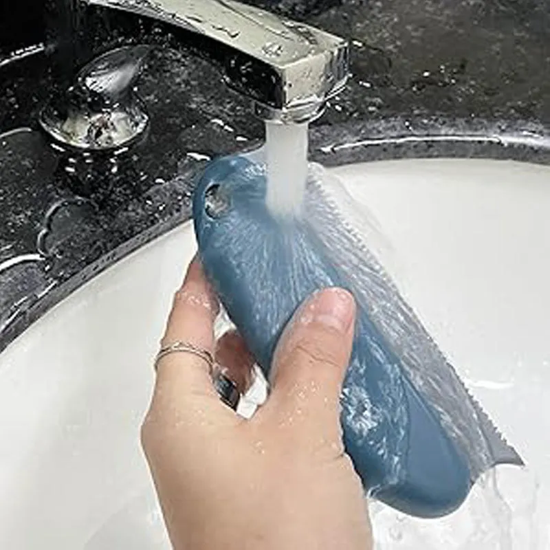 Dark blue pet hair remover brush with double serrated comb on a car seat