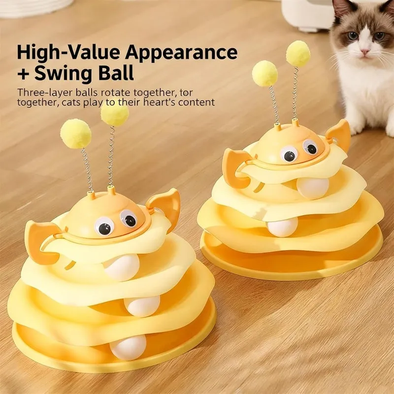 Cat toy tower with rotating bee toy and three-layer trackball in green plastic, placed on a wooden floor
