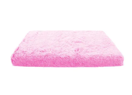 Plush square pet bed with wave memory foam in a gray colour on a wooden floor
