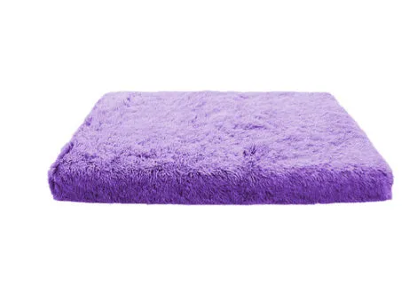 Plush square pet bed with wave memory foam in a gray colour on a wooden floor