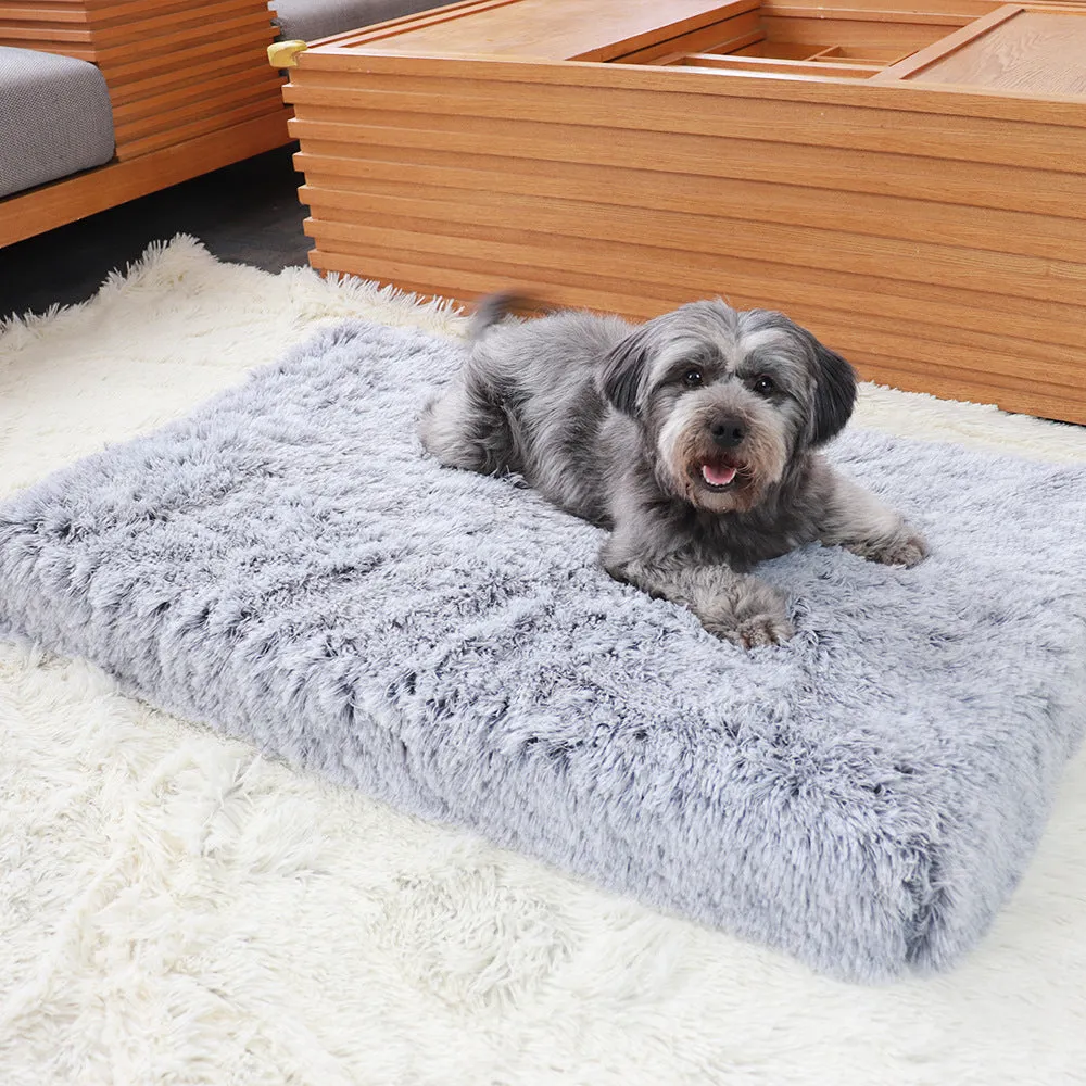 Plush square pet bed with wave memory foam in a gray colour on a wooden floor