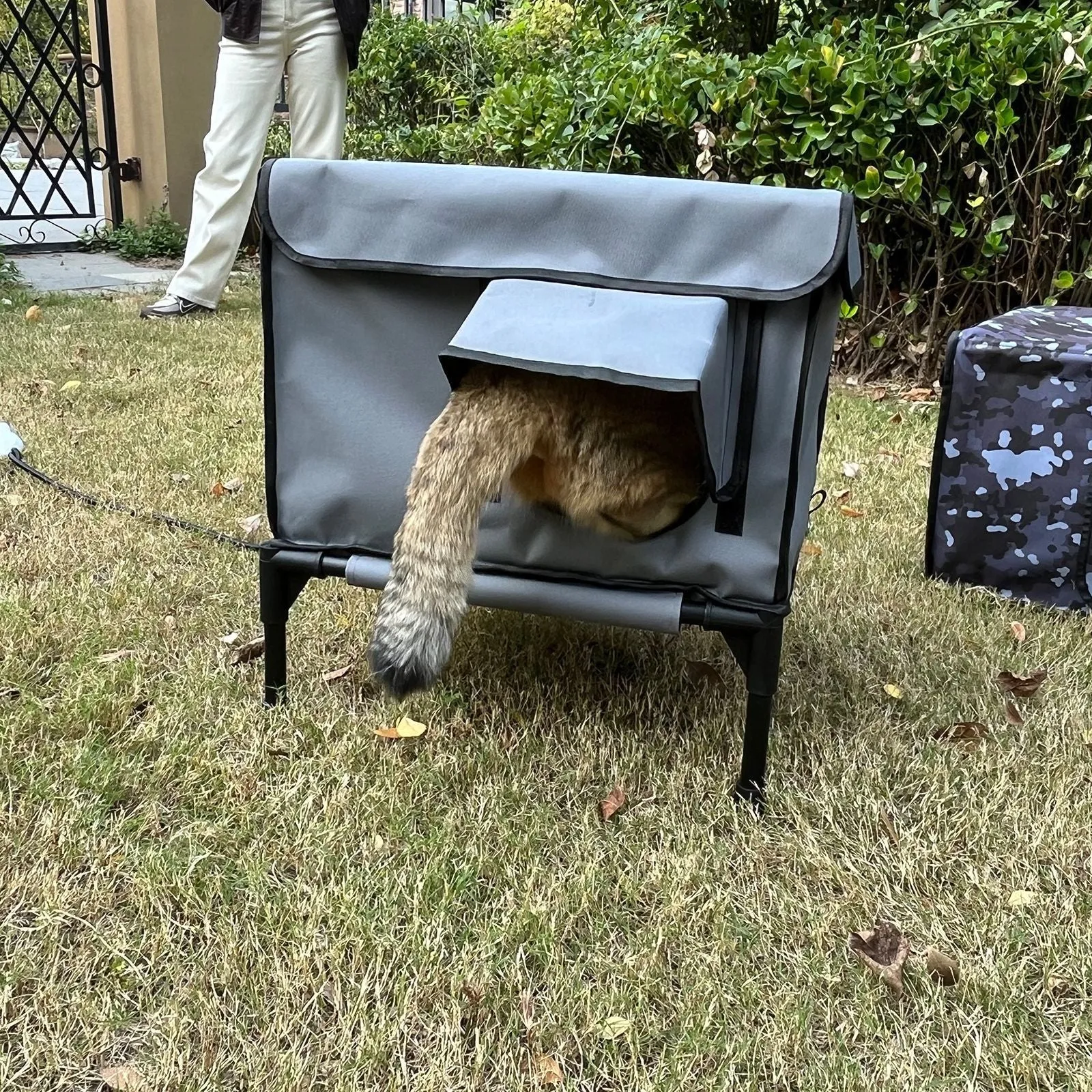 Outdoor heating insulation foldable cat nest with thermo sensitive switch in black, size M, on a floor