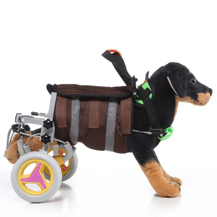 Grey dog wheelchair with adjustable frame, two wheels, and carrying handle on a light background