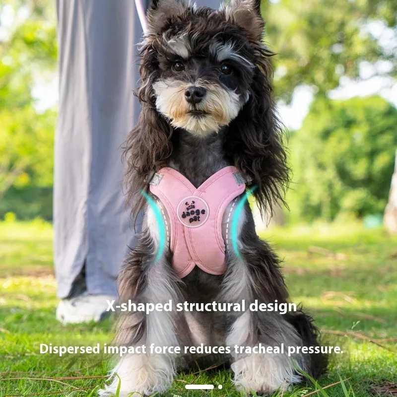 Pink polyester dog vest with an attached hand holding rope laid flat