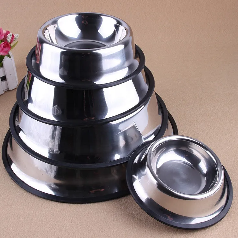 Classic stainless steel pet bowl with non-slip rubber base on a tiled floor