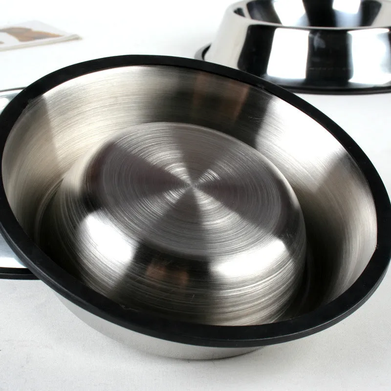 Classic stainless steel pet bowl with non-slip rubber base on a tiled floor