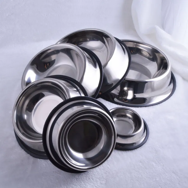 Classic stainless steel pet bowl with non-slip rubber base on a tiled floor