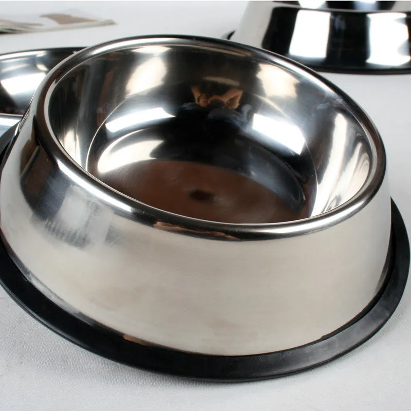 Classic stainless steel pet bowl with non-slip rubber base on a tiled floor