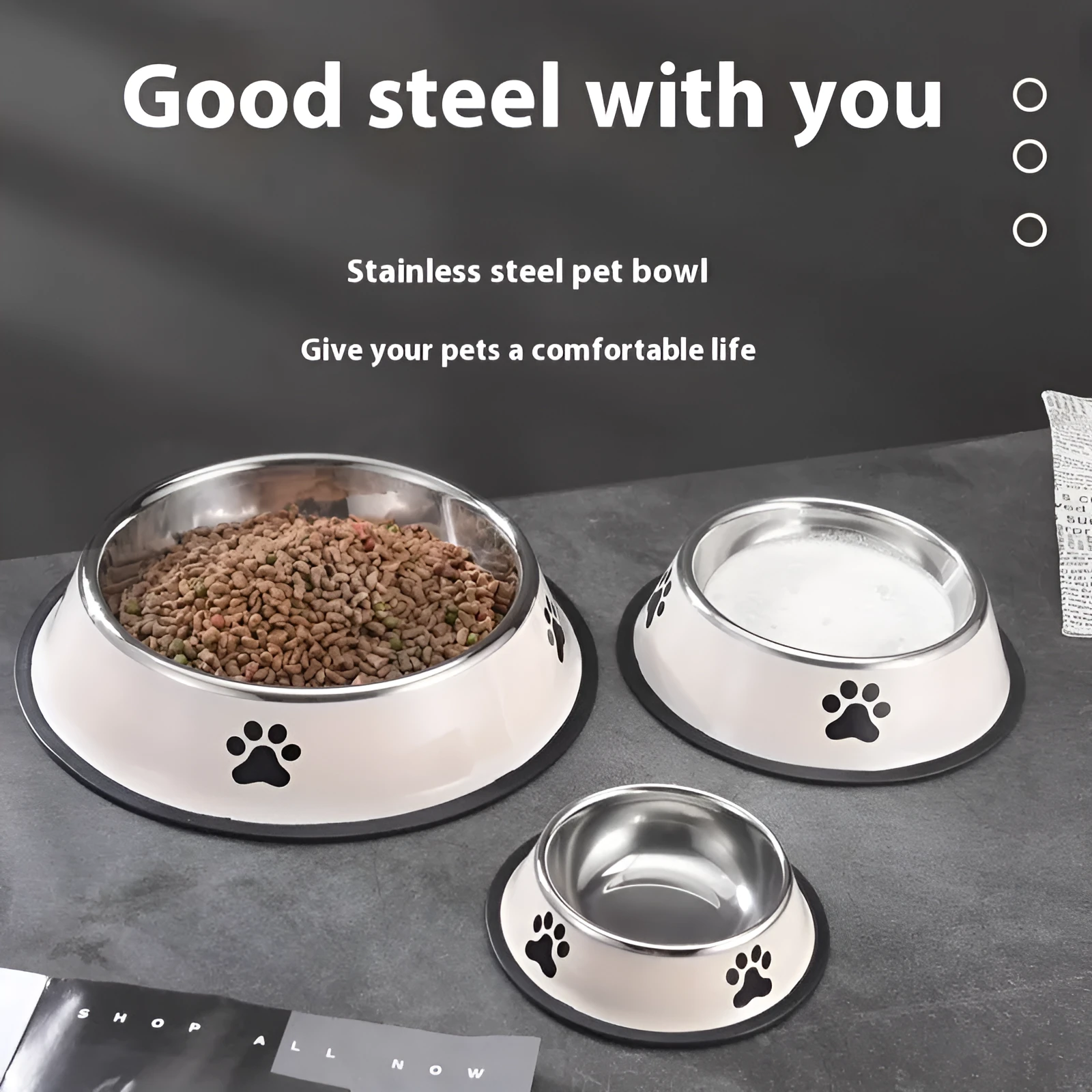 Printed non-slip stainless steel pet bowl for dogs and cats in gray, shown on a floor