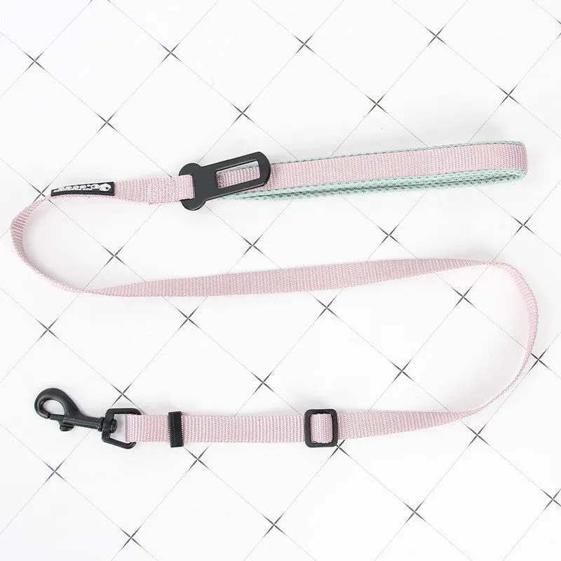 Nylon adjustable dog breast strap with hand holding rope in blue pink colour on white background