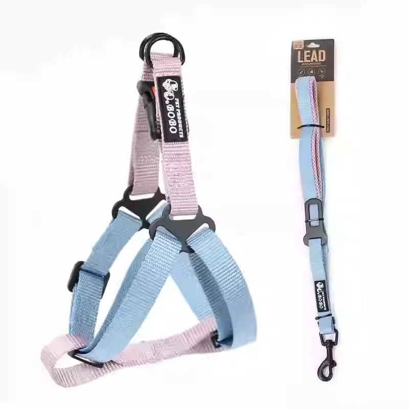 Nylon adjustable dog breast strap with hand holding rope in blue pink colour on white background