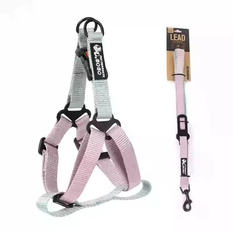 Nylon adjustable dog breast strap with hand holding rope in blue pink colour on white background