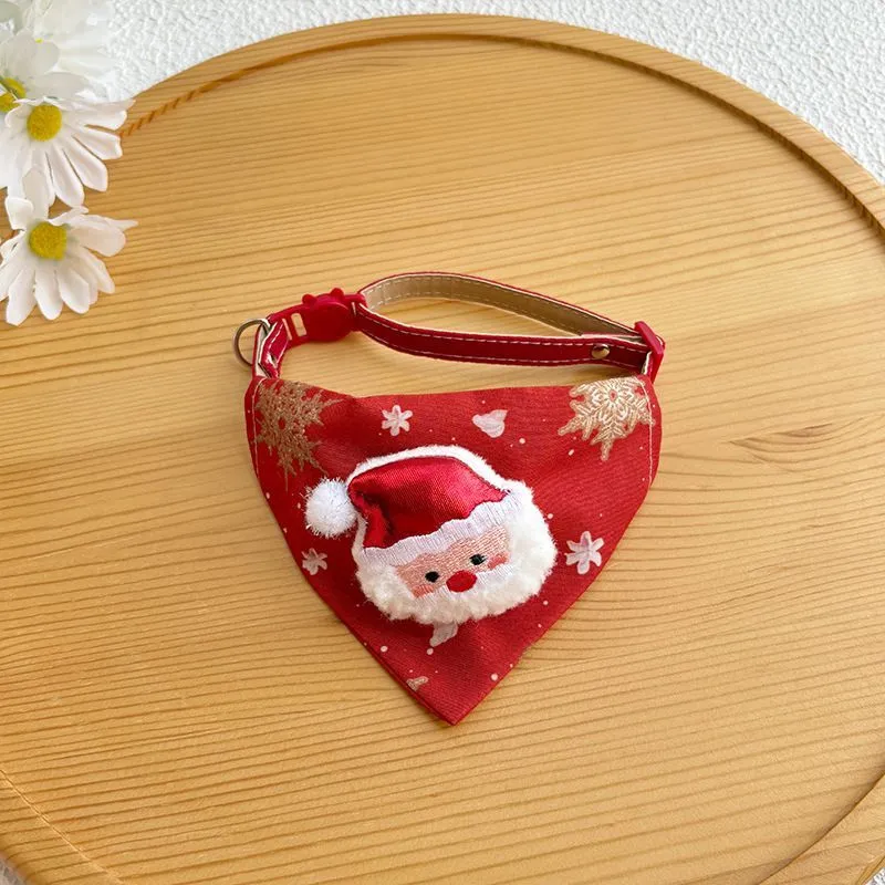 Red Christmas pet bandana with Santa Claus and Christmas tree appliques on white background