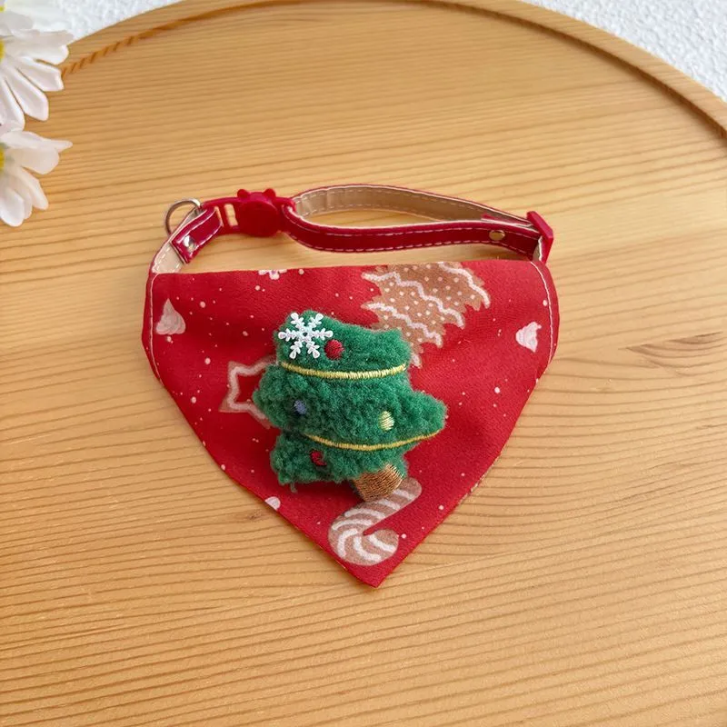 Red Christmas pet bandana with Santa Claus and Christmas tree appliques on white background
