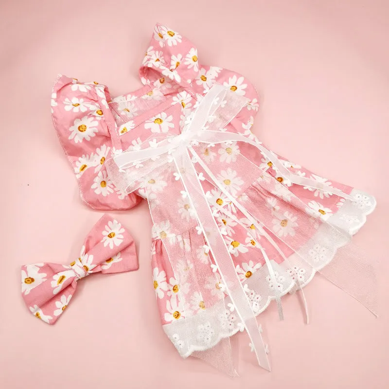 Breathable lace and plaid gauze dog skirt in Pink Daisy with matching bow necklace on a small dog