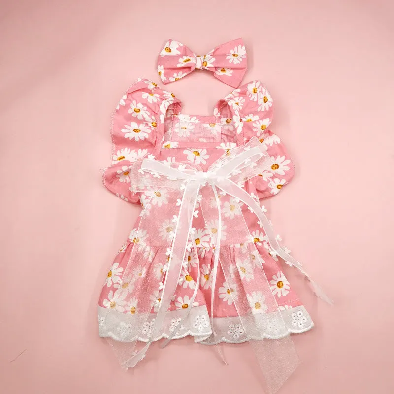 Breathable lace and plaid gauze dog skirt in Pink Daisy with matching bow necklace on a small dog