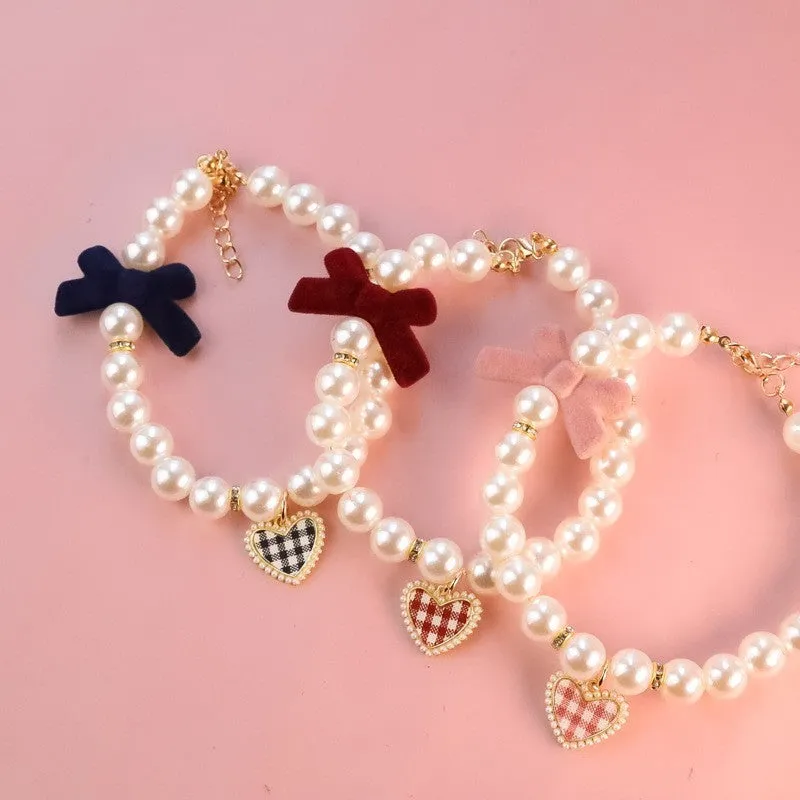 Plastic pet necklace bow tie in plaid black for dogs and cats with retro texture