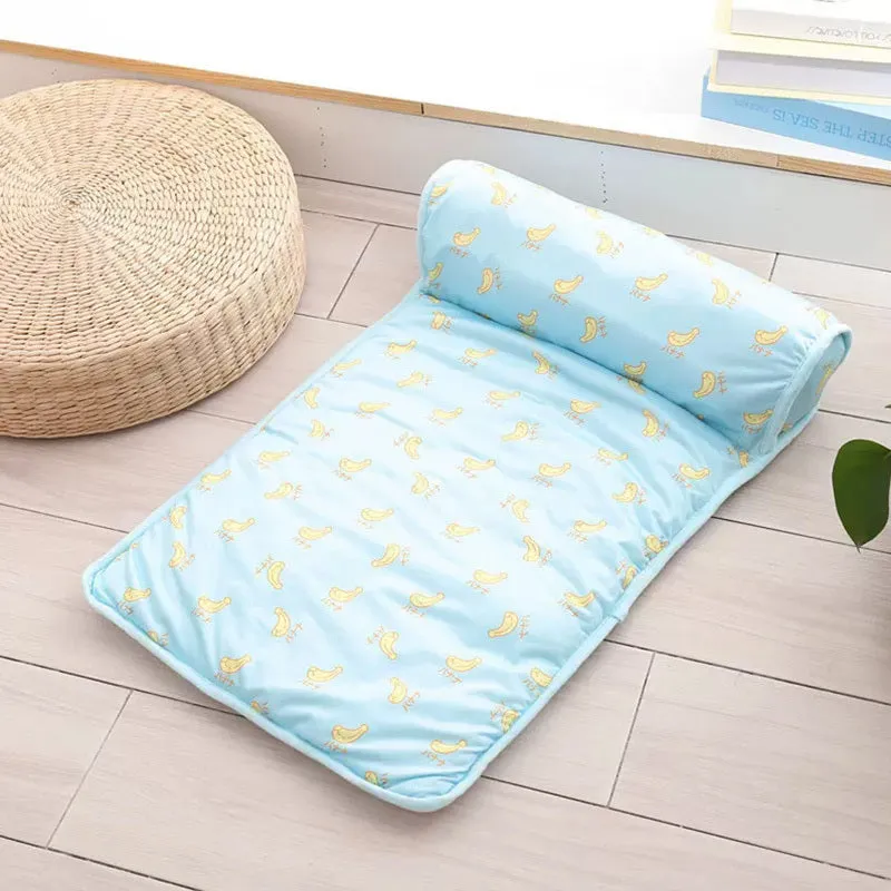 Blue cooling dog mat on floor with small dog lying on it, breathable ice silk cotton surface