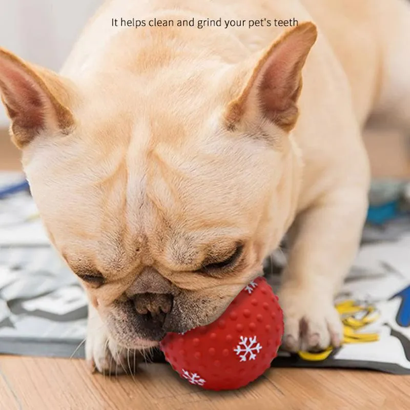 Red and green Christmas dog toy ball with snowflake pattern, approximately 7cm diameter