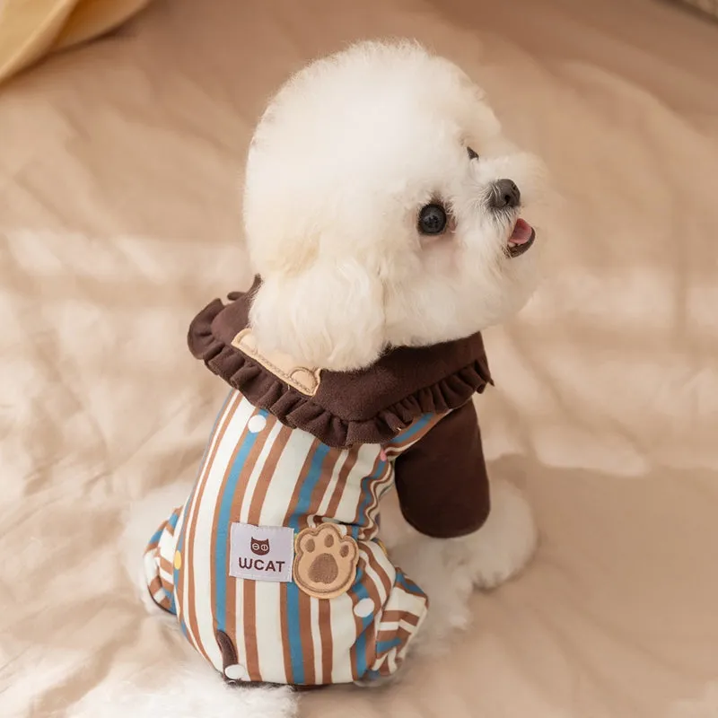 Brown small dog onesie with bear-embroidered ruffled collar, striped blue and brown body, and paw print patch