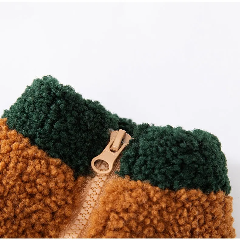Colour-block pet fleece jacket with squirrel patch, leash ring, and pockets in green, brown, and beige on a small dog.