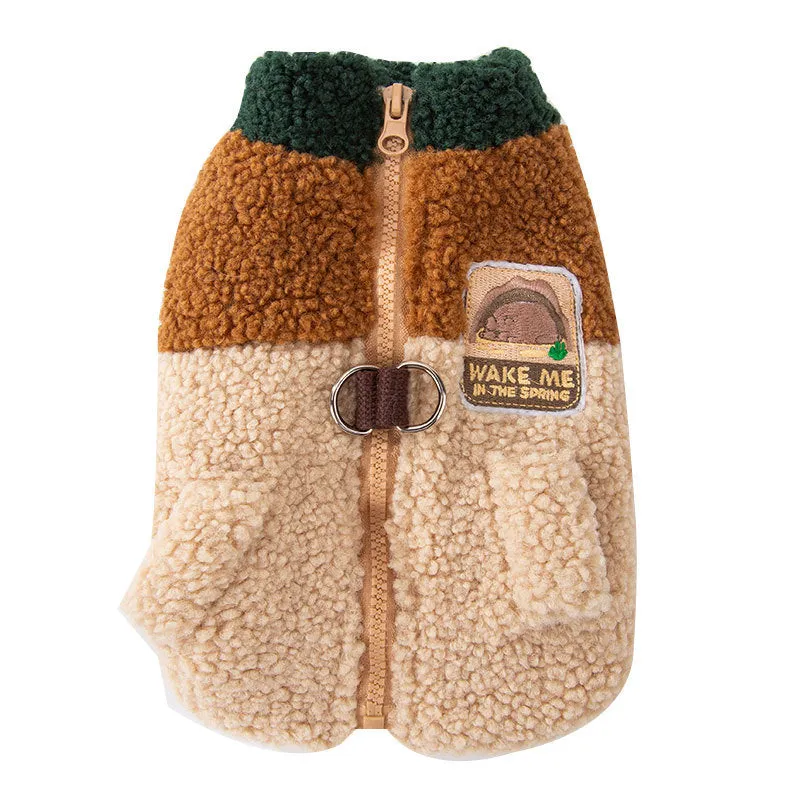 Colour-block pet fleece jacket with squirrel patch, leash ring, and pockets in green, brown, and beige on a small dog.