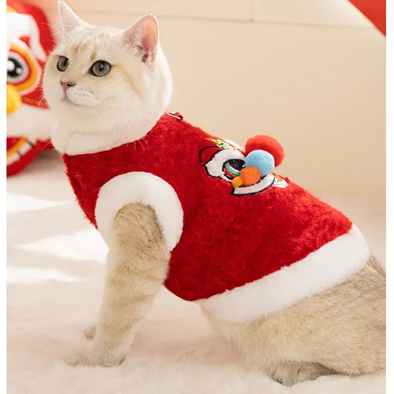 Red pet lion dance sweater with 3D face, colourful pom-poms, and leash ring on small dog