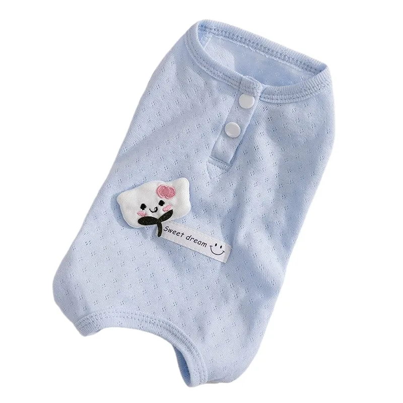 Soft yellow mesh pet shirt with cartoon cat patch and button closure on a small dog or cat